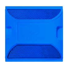 Tacha reflectiva PrismaLux vista cenital mostrando superficie reflectante para demarcación vial