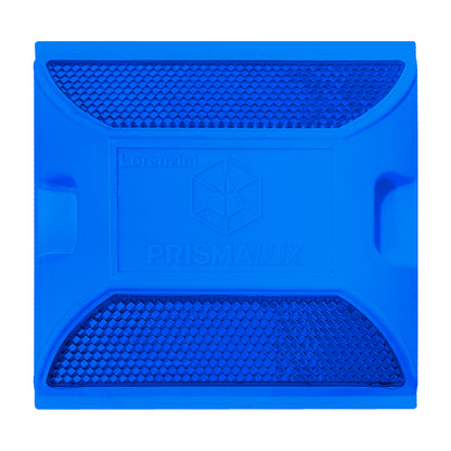 Tacha reflectiva PrismaLux vista cenital mostrando superficie reflectante para demarcación vial