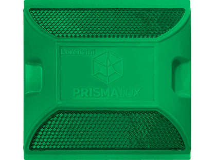 Dispositivo de señalización vial con superficie reflectante visto desde ángulo cenital